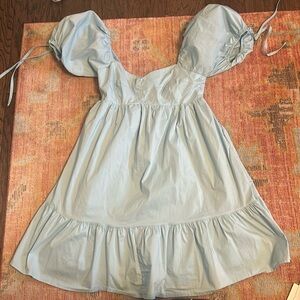 Blue mini dress with poofy sleeves that tie